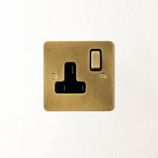 Lucian single socket with black inserts in aged brass