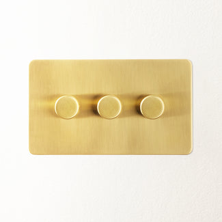 Lucian three gang dimmer switch in top brass