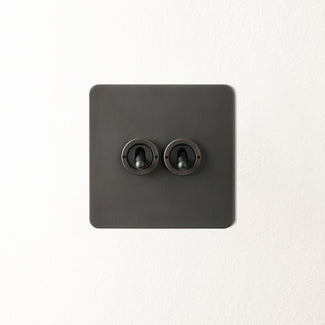 Lucian two gang intermediate toggle switch in bronze