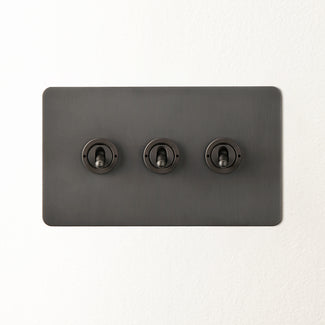 Lucian three gang 2 way toggle switch in bronze