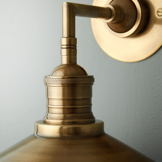 Whizzer Wall Light in Antique Brass